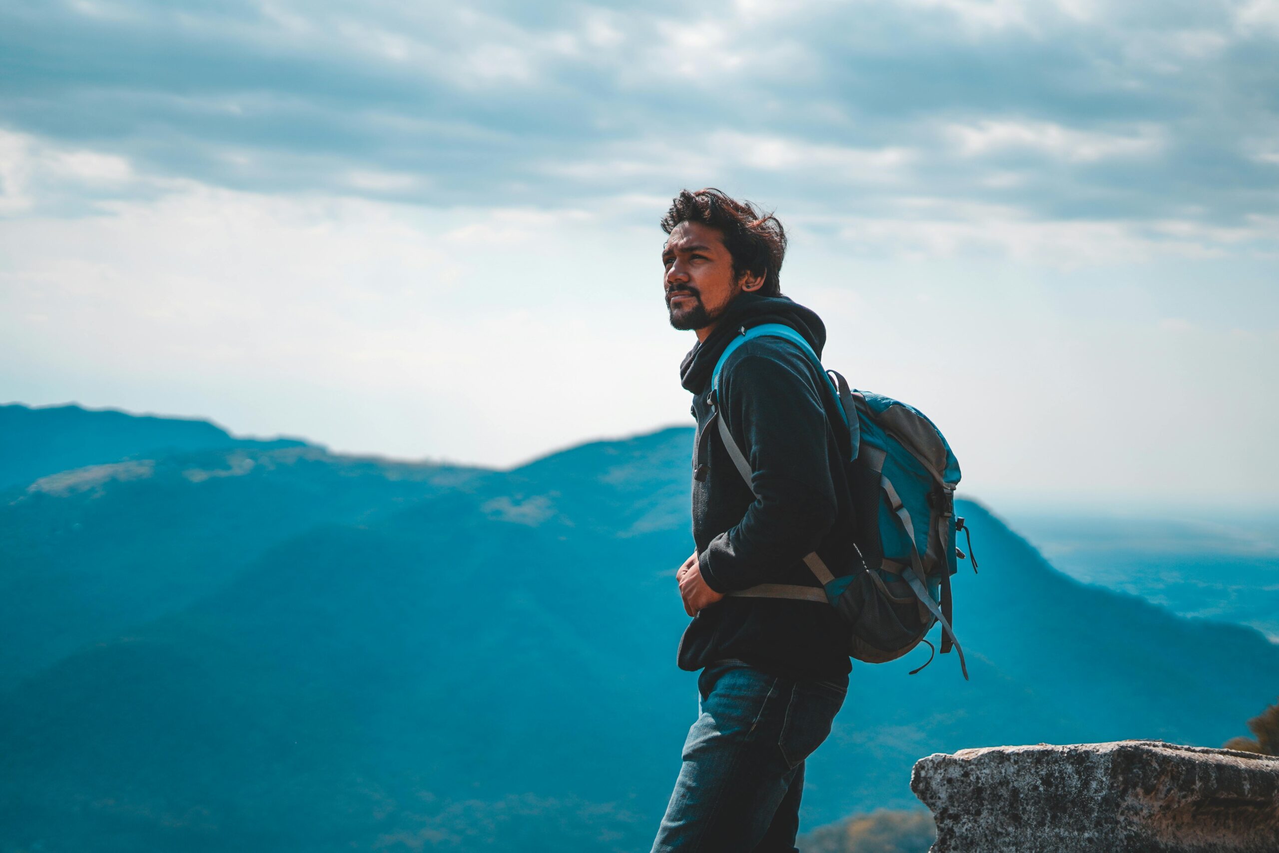 hiker at mountain gazing at view